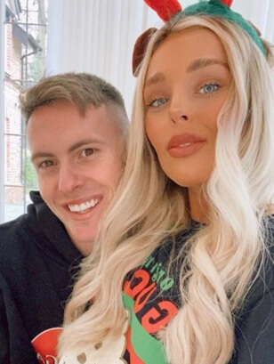 Dean Henderson with his wife.